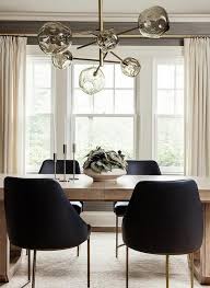 Light Brown Oak Dining Table With Black Leather Chairs Brings A Modern Finish Under A Smoke Gray Han Light Oak Dining Table Oak Dining Table Brown Dining Table