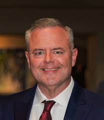 Who has had a haircut at this barber shop in Charlottesville?