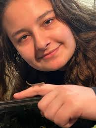 Nicole found a hatchling Mourning Gecko in the small tank that has a  communal pile of eggs.