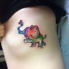 Elephant tattoos look good on both men and women. Watercolor Tiny Elephant Tattoo On Rib Side