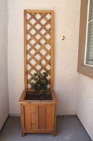 The boxes are sitting on a homemade gardening bench made from shipping pallets. Cedar Planter With Trellis Ana White