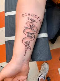 I already have 11 tattoos and just became a type 2 diabetes last spring. My Type 1 Diabetes Tattoo It S A Fun Play On The Medical Symbol With The Syringe And The Cool Snake Boi Done By Nick Kaltenbach At Bitterroot Tattoo Moscow Idaho Tattoos