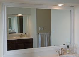 To keep the frame in place while the adhesive is drying, use strips of painter's tape. Framing Bathroom Mirrors The Hard Way Uniquely Yours Or Mine