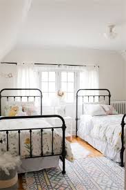 Can you hear a harpsichord providing some romantic background this wrought iron canopy bed is shown with an exquisite wrought iron chandelier. Wrought Iron Beds You Can Crush On All Day Shared Girls Bedroom Shared Girls Room Iron Bed Frame