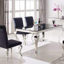 These dining chairs rest on chrome metal legs that are slim but also sturdy. Tips To Have Beauty Dining Room With These Best Home Dining Room Furnitures Dining Table Design Modern Black Glass Dining Table Chrome Dining Table