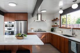 Gray stone tile is a nice transition from a white countertop to dark cabinets. Best 45 Modern Kitchen Wood Cabinets Porcelain Tile Backsplashes Dwell