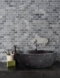Dark grey veins and thick patterns of richness often characterize calacatta marble, and it is often paired in a kitchen with stainless steel or metal appliances. Bluestone Tumbled Marble Mosaic Tile Mandarin Stone