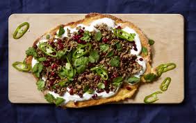 Wholemeal flatbread with butternut, bulgar wheat and green harissa finished with houmous and tzatziki. Middle Eastern Lamb Flatbread Snack Recipes Woman Home