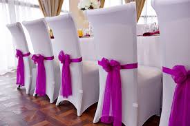 Metallic colored organza sash over white wedding chair coverings gives it a classy and elegant touch. Why Use Chair Sashes