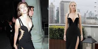 Hurley's new version includes one sleeve, a more demure bodice, and a slash across the stomach. Bazaaruk On Twitter Jennifer Lawrence Channels Elizabeth Hurley In That Safety Pin Dress Https T Co M3blplfcoh