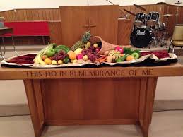 Thanksgiving Sunday Communion Table Decorated With A Cornucopia Fresh Fruit And Veggies Communion Table Table Decorations Thanksgiving Sunday