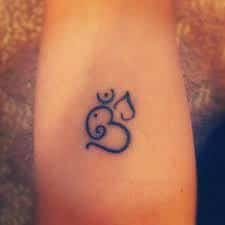 Lotus with om tattoo designs on rib. What Does Om Tattoo Mean Represent Symbolism