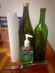 How To Remove Wine Bottle Labels In 3 Minutes Get A Bottle Of Hand Sanitizer A Couple Paper Towels A But Wine Bottle Diy Crafts Wine Bottle Art Diy Bottle