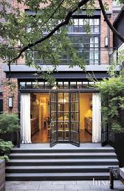 For an open airy feel folding sliding glass doors are a must. Folding Glass Patio Doors Transitional Home Exterior