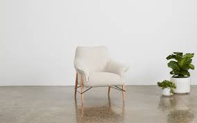 Woman sitting in a chair and using her laptop. Save 20 On The Koala High Back Armchair Koala S End Of Financial Year Sale Is Now On Koala