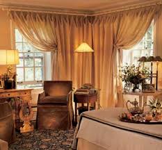 Camouflage a corner window by extending the drapery treatment beyond the edges. Window Treatment Ideas For Corner Windows Better Homes Gardens