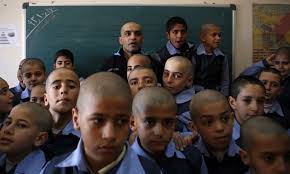 Hundreds of Iranian students shave their heads after teacher diagnosed with  cancer