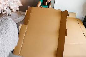 Fold each side of the paper to the center crease and unfold it. How To Make A Cardboard Holiday Fireplace Hgtv