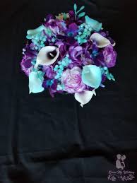 Bride holding bridal bouquet with white, pink and purple flowers. Dress My Wedding Purple Hydrangea Turquoise Teal Bridal Bouquet Royal Purple Galaxy Orchids Carnations Artificial Flower Bouquet