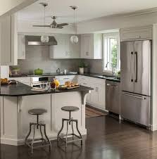Small Chic Kitchen Features A Minka Aire Ceiling Fan Cooling Extra Light Gray Cabi Kitchen Remodel Countertops Kitchen Cabinets Decor Black Quartz Countertops