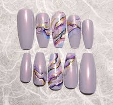 Light pink nails coffin are perfect if you are going for a very soft and demure look and will transition well from work to play. Light Purple Coffin Nails With Stunning Marble Design Press On Nails Coffin Nails Long Rhinestone Nails