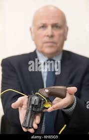 Ray Wilkinson holding a gun at Police Headquarters West Midlands Police  Lloyd House, Birmingham, after he was prompted to hand in a cache of  weapons belonging to his late uncle following the publicity surrounding the  launch of the national firearms ...