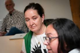 When aid workers need aid. We visit a support group for laid-off  international development workers