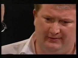 Colin "Jaws" Lloyd punches the darts board