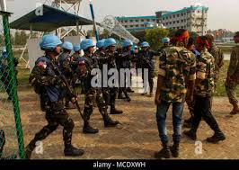 Philippines Marines begin to move back a group of riot role-players as part  of a site security field training exercise during Exercise Shanti Doot 4.  Shanti Doot 4 is a multinational United Nations peacekeeping exercise with  more than 1,000 participants from ...