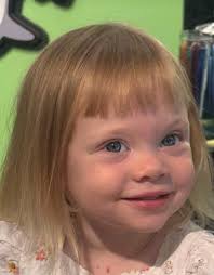 After a few giggles and a few wiggles, our 2 year old granddaughter just  had her first haircut! And her new bangs feel like the perfect match for  her very bright little