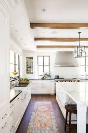 Later, things became more organized into geometric sections with polymorphic shapes. Classic Spanish Meets California Cool In This Striking Kitchen Makeover Kitchen Cabinet Design White Kitchen Design Kitchen Design