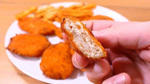 A) a lump of fried chicken in which the entire kfc franchise is based around. Chicken Nuggets With Cheese A Very Delicious Appetizer