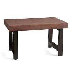 Industrial iron paired with reclaimed solid pine not only looks beautiful but also stands up to years of entertaining. Griffin 33 Reclaimed Wood Coffee Table Pottery Barn