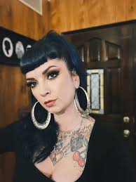 I need some help please This is the shirt/hair colour combo I'm wearing for  the trip of a lifetime in September. What colour jewellery should I use in  my piercings? Pics in