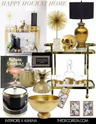 Black And Gold Bar Cart Entertaining Summertime Bar Cart Style Black And Gold Glamour At Home The Decorista Gold Bar Cart Bar Cart Decor Decor