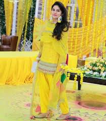 35 Trendy Haldi Outfit Ideas For The Bride Haldi Ceremony Dresses Styling Tips Ceremony Dresses Designer Party Wear Dresses Mehendi Outfits