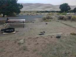 Across from the sand dunes on the main road. Site 037 Pinon Flats Campground Recreation Gov