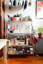 My 1 000sqft Tour A Newly Transplanted Couple S Bushwick Apartment Filled With Craigslist Finds 6sqft Apartment Kitchen Organization First Apartment Decorating Small Apartment Kitchen