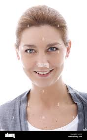 Isolated portrait of a single female Blue rock thrush bird eating an insect  in the wild- Armennia Stock Photo