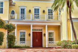 The rich shade of blue acts almost as a neutral for the exterior house paint color. Front Door Color For A Yellow House Inc 11 Examples In Pictures Home Decor Bliss
