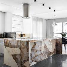 The idea of a kitchen where everything matches is a thing of the past. Showstopping Kitchen Island Made Of Patagonia Quartzite This Stone Has Incredibly Unique Appeal It Has White Marble Kitchen Kitchens Luxury Kitchen Marble