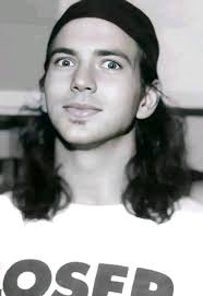 Eddie Vedder hanging from the rafters while Pearl Jam performs at Drop in  the Park, a free show held in 1992 at Magnuson Park in Seattle, WA. [Photo  by Lane Mercer Photography] |