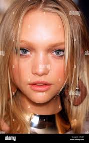 Backstage Milan Spring Summer Dolce & Gabbana Model Gemma Ward long blonde  hair and black mascara, wearing large polished wood Stock Photo