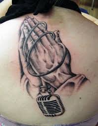 Prayer quote lower back tattoo. 77 Elegant Praying Hands Tattoos On Back