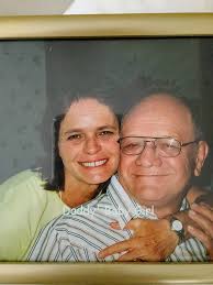 Can someone restore this photo of me and my dad so it doesn't have the  cloudy look around us. Deeply appreciate it. Thank you in advance