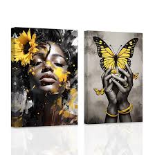 لوحة فنية جدارية من زد اكس اتش واي دبليو واي ام مكونة من قطعتين بتصميم يد  امرأة سوداء مع صورة فراشة بلون اسود واصفر ورمادي، لوحة قماشية مطبوعة على  شكل زهرة عباد