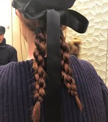 A ribbon worn in the hair. Black Hair Ribbons Have The Runway And Red Carpet All Wrapped Up Thefashionspot