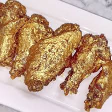 Although the terms sound familiar, the karat (k) system used to measure the purity of gold is different from the carat (c) unit of mass that's used to weigh diamonds. Sweet Flamingo Debuts Chicken Wings Slathered In 24 Karat Gold In Katy Eater Houston