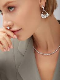 Simple and striking in the same breath. A tennis necklace and diamond  cluster drops doing what they do best.✨ DM to schedule an in-person  viewing. #tennisnecklace #diamonddropearrings #naturaldiamond #finejewelry  #menlopark #bayareajeweler