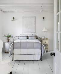 Modern sconces and a bddw lounge chair tie the. 45 Best White Bedroom Ideas How To Decorate A White Bedroom